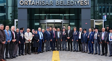 BAŞKAN KAYA, KIBRIS GAZİLERİNİ VE ŞEHİT AİLELERİNİ AĞIRLADI
